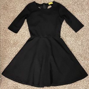 Structured black cocktail dress with keyhole back detail